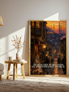 10 Minutes 38 Seconds in This Strange World watercolour print in frame leaning in hallway – contemporary fiction wall art