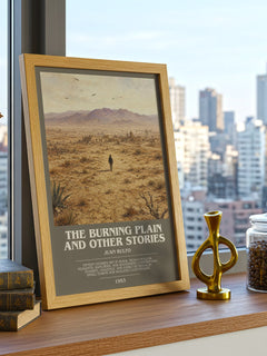 The Burning Plain and Other Stories Bookish Wall Art by Juan Rulfo – framed print on a city-view windowsill