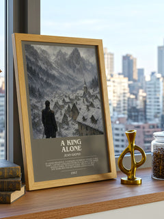 A King Alone Bookish Wall Art by Jean Giono – framed print on a city-view windowsill