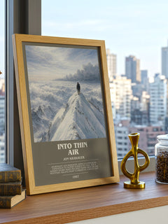 Into Thin Air Bookish Wall Art by Jon Krakauer – framed print on a city-view windowsill