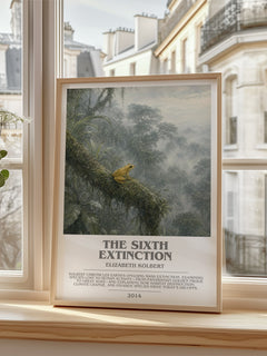 The Sixth Extinction Bookish Wall Art by Elizabeth Kolbert – framed print by a bright window