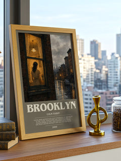 Brooklyn Bookish Wall Art by Colm Toibin – framed print on a city-view windowsill