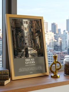 Bread Givers Bookish Wall Art by Anzia Yezierska – framed print on a city-view windowsill
