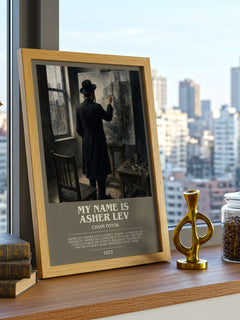 My Name Is Asher Lev Bookish Wall Art by Chaim Potok – framed print on a city-view windowsill