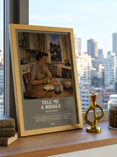 Tell Me a Riddle Bookish Wall Art by Tillie Olsen – framed print on a city-view windowsill