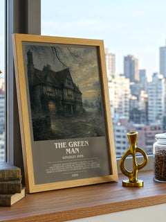 The Green Man Bookish Wall Art by Kingsley Amis – framed print on a city-view windowsill
