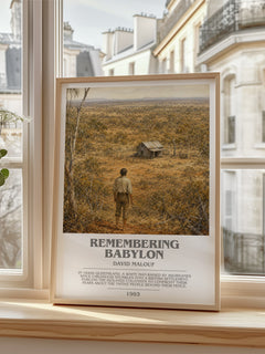 Remembering Babylon Bookish Wall Art by David Malouf – framed print by a bright window