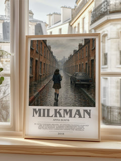 Milkman Bookish Wall Art by Anna Burns – framed print by a bright window