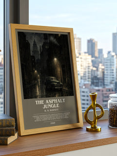 The Asphalt Jungle Bookish Wall Art by W. R. Burnett – framed print on a city-view windowsill