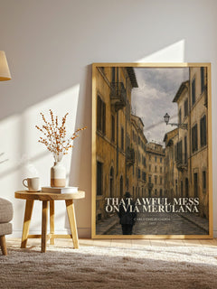 That Awful Mess On Via Merulana watercolour print in frame leaning in hallway – mystery wall art