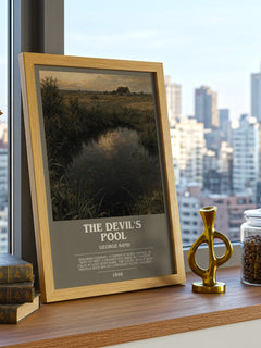 The Devil's Pool Bookish Wall Art by George Sand – framed print on a city-view windowsill