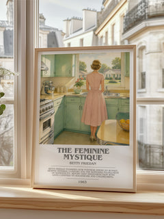 The Feminine Mystique Bookish Wall Art by Betty Friedan – framed print by a bright window