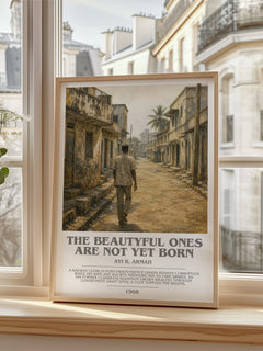 The Beautyful Ones are Not Yet Born Bookish Wall Art by Ayi K. Armah – framed print by a bright window
