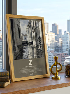 Z Bookish Wall Art by Vassilis Vassilikos – framed print on a city-view windowsill