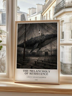 The Melancholy of Resistance book cover print in frame leaning in hallway – literary fiction wall art