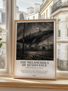 The Melancholy of Resistance bookish print in frame leaning in hallway – literary fiction wall art