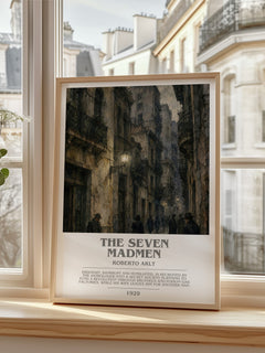 The Seven Madmen bookish print in frame leaning in hallway – literary fiction wall art