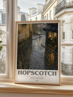Hopscotch book cover print in frame leaning in hallway – literary fiction wall art