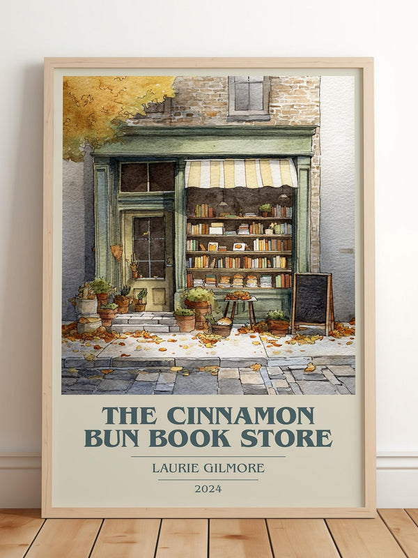 The Cinnamon Bun Book Store book cover print in frame leaning in hallway – romance wall art