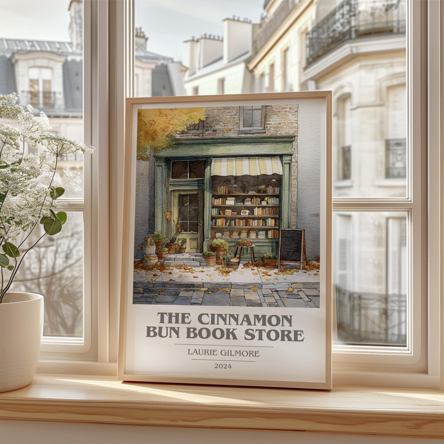 The Cinnamon Bun Book Store book cover print framed by window – literary home decor